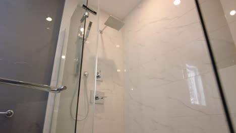 modern-bathroom-pov-look-at-tub-then-go-into-standup-shower-real-estate-smooth-gimbal