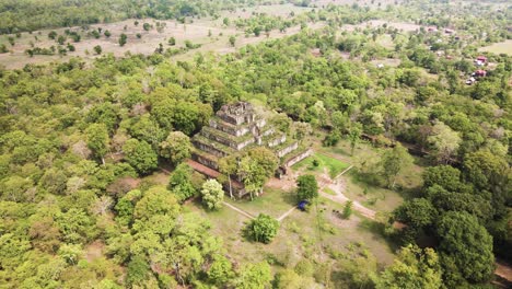 Angkor-temple-Aerial,-Prang---The-Koh-Ker-pyramid-temple,-nested-in-the-mystic-Cambodian-jungle,-drone-rotation-4k-footage