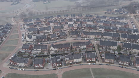 Aerial-overview-of-solar-panels-on-rooftops-of-houses-in-suburban-neighborhood