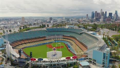 Spinning-aerial-view-of-Downtown-Los-Angeles-and-Dodgers-Stadium