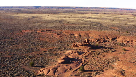 Aerial-orbit-around-Wukoki-Pueblo-ruins-in-the-desert-surrounded-by-red-sandstone-rock-formations