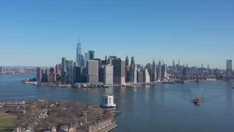 An-aerial-view-of-New-York-harbor-on-a-sunny-day-with-clear-blue-skies
