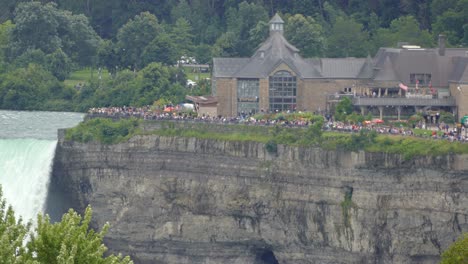 Large-group-of-tourists-view-Niagara-Falls-table-rock-welcome-center