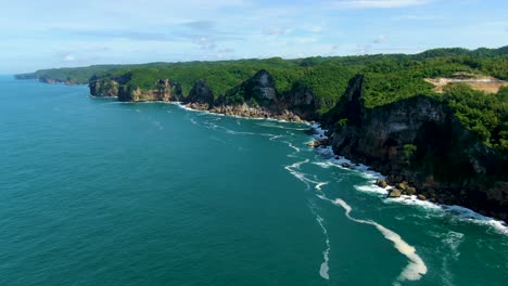 Picturesque-coastal-cliffs-on-tropical-Java-Island,-Indonesia,-aerial-view