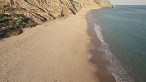 Praia-da-Luz-coast-fly-over-towards-Rocha-Negra-headland,-Algarve
