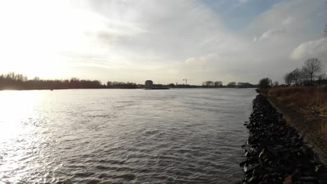 View-Of-Barge-River-Oude-Maas-In-Dordrecht-and-Zwijndrecht,-Netherlands---drone-shot