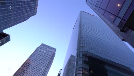 POV-looking-up-at-skyscrapers-of-London,-Canary-Wharf