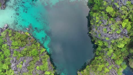 Aerial-view-of-beautiful-karst-scenery-and-turquoise-ocean-waters-around-Coron,-Palawan,-Philippines