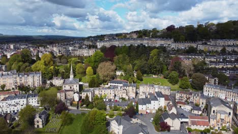 Rising-aerial-looking-overa-residential-area-in-Bath,-Somerset,-including-the-stunning-Camden-cresent