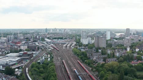 slow-dolly-forward-drone-shot-of-busy-London-Clapham-Junction-train-station