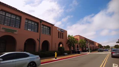 Driving-Along-Truxtun-Road-In-Residential-District-Of-Liberty-Station-In-San-Diego,-California-Passing-By-Business-Buildings-On-A-Fine-Weather