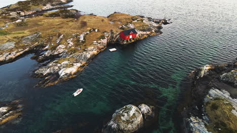 Rocky-Islands-With-Red-Boathouse-Near-Atlantic-Ocean-Road-In-Atlanterhavsveien,-Norway