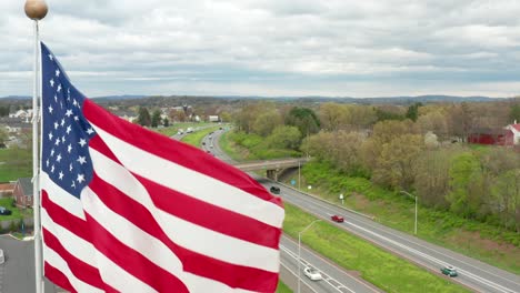 Close-up-aerial-of-America-flag-waving-in-breeze