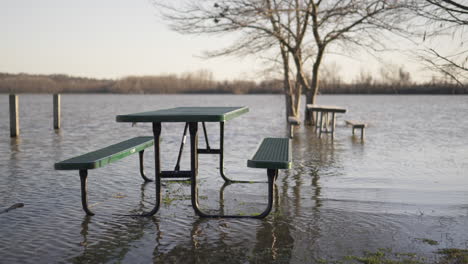 Static-slomo-shot-of-flooded-picnic-table-area