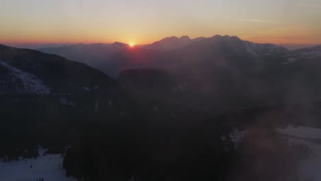Aerial-reveal-view-of-Rolle-Pass-at-sunset,-Dolomites