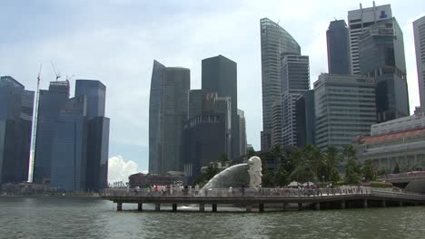 The-Merlion-and-Business-Financial-Downtown-City-and-Skyscrapers-Tower-Buildings-at-Marina-Bay
