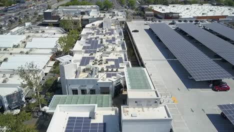 Solar-panels-on-rooftop,-Topanga-Canyon-Mall,-aerial-view,-daytime