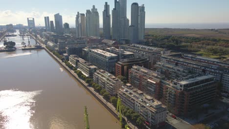 Aerial-view-of-Puerto-Madero-buildgins-revealing-an-ecological-reserve-behind