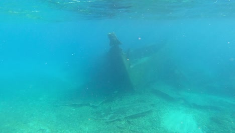 Sunken-boat-shipwreck-on-shallow-ocean-waters