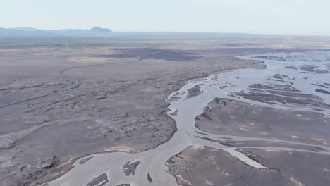 Vast-river-delta-landscape-in-barren-land-of-Iceland,-aerial