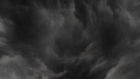 4K-thunderstorm-flash-over-the-night-sky-and-grey-clouds