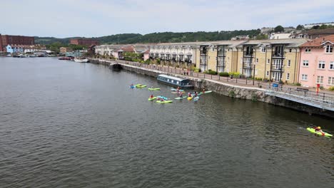 Group-of-people-in-canoes-on-river-Avon-Bristol-City-Uk-drone-footage