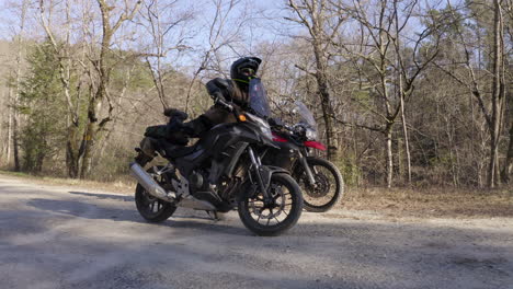 Two-men-start-an-travel-adventure-trip-on-motorcycles---push-in-view