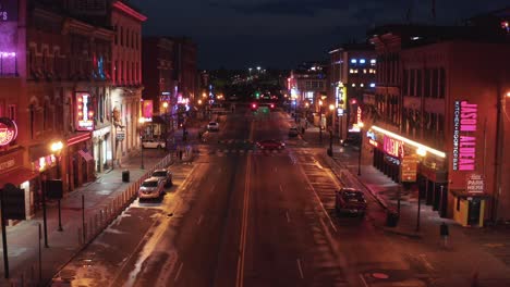 Traffic-drives-through-Lower-Broadway-in-Nashville-at-night