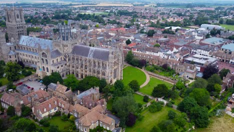 Aerial-view-of-Ely-Cathedral-with-scenic-urban-cityscape-in-England,-drone-tracking-shot