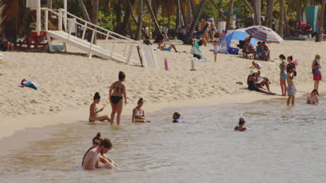 Tourists-Sunbathing-on-Tropical-Beach-Vacation-in-San-Juan,-Puerto-Rico---Static