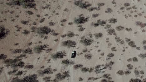 Aerial-top-down-view-of-off-road-safari-in-Namibia,-Africa
