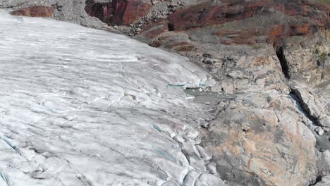 Glacier-ice-sheet-melting-and-fracturing-in-mountain-valley,-global-warming