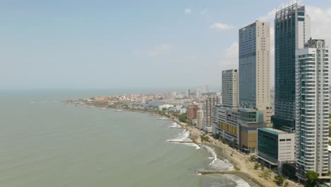 Aerial-Establishing-Shot,-Cartagena-Skyscrapers,-Old-City-in-Background