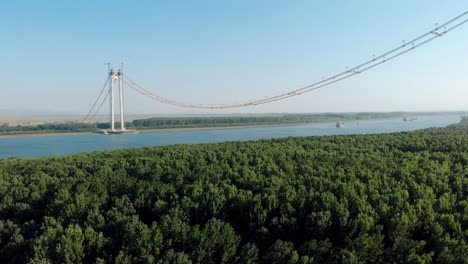The-Suspension-Bridge-over-the-Danube,-Romania---connections-between-Braila-Tulcea,-under-construction---aerial-drone-shot
