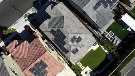 Aerial-orbit,-solar-panels-over-houses-in-Tustin-neighborhood,-clean-energy