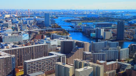 Asia-Business-concept-for-real-estate-and-corporate-construction,-modern-city-skyline-aerial-view-of-Tokyo-under-blue-sky-in-Japan