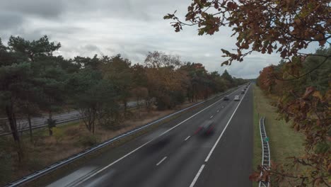 Motion-Timelapse-Of-Vehicles-Driving-On-The-Highway-During-Autumn