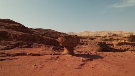 An-interesting-mushroom-like-rock-formation-in-the-desert,-filmed-in-Nature-Park-Timna,-southern-Israel