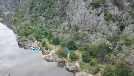Aerial-view:-River-raft-camp-site-on-flat-section-of-Snowy-River,-VIC