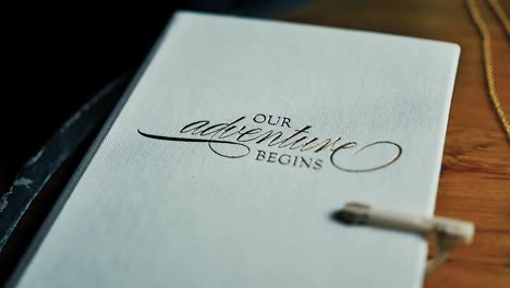 A-journal-for-a-wedding-that-reads-"OUR-adventure-BEGINS
