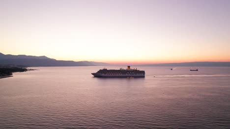 Costa-Luminosa-cruise-ship-during-early-bright-sunrise-near-shore-of-Croatia