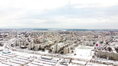 Kalnieciai-district-in-Kaunas-city-covered-in-white-snow-during-heavy-snowfall,-aerial-view