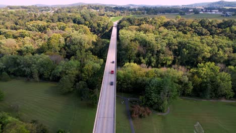 cars-on-road-crossing-bridge-near-munfordville-kentucky,-transition-shot-in-movie-or-tv-program