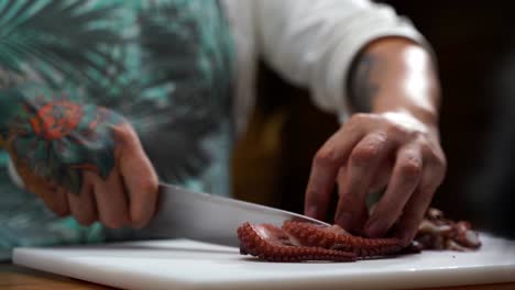 Chef-cutting-octopus-tentacles-in-Mexican-restaurant