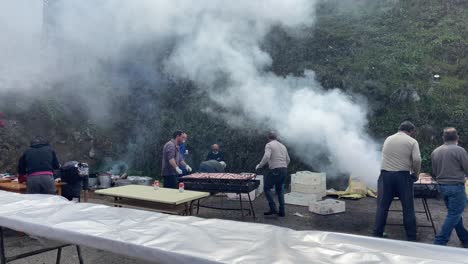 Traditional-village-people-grilling-a-great-barbecue-after-the-popular-pig-slaughter-feast