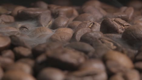 Close-up-slow-motion-shot-of-smoke-released-during-the-roasting-of-organic-coffee-beans