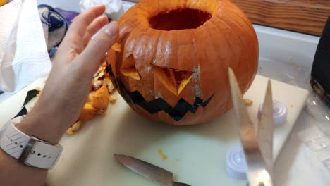 Pumking-being-carved-to-make-a-jack-o'-lantern-for-Halloween
