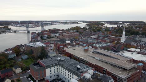 Aerial-view-overlooking-the-city-center-of-Portsmouth,-New-Hampshire,-USA---pan,-drone-shot