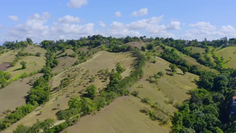Lush-Green-Hills-In-El-Caimito,-Dominican-Republic-At-Daytime---aerial-drone-shot