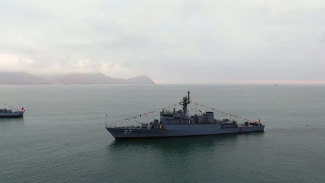 Fleet-Of-Peruvian-Navy-Ships-In-The-Sea-With-BAP-Ferre-In-Focus-Against-Foggy-Background